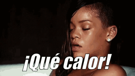 a woman with a shaved head is taking a bath and says que calor