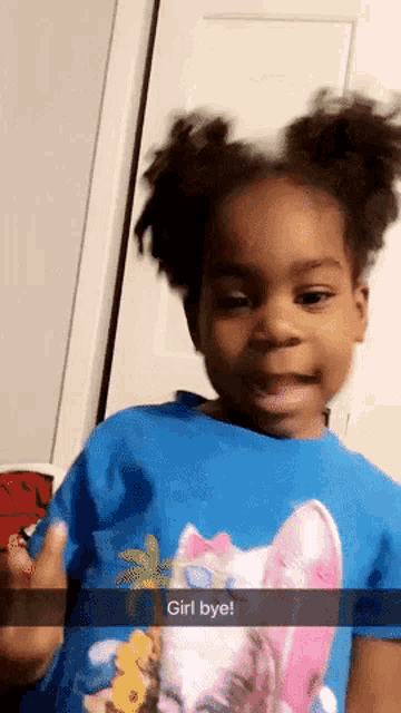a little girl wearing a blue shirt that says " girl bye " on it