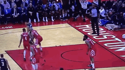 basketball players on a court with the word houston on the floor
