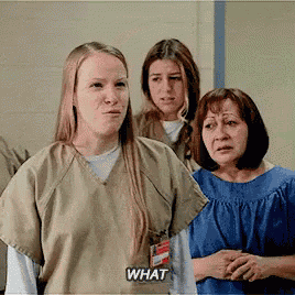 a group of women are standing next to each other and one of them says what
