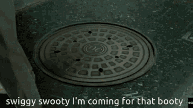 a manhole cover with the words swaggy swooty i 'm coming for that booty written on it