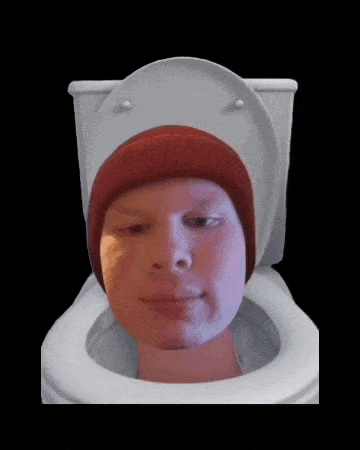 a man wearing a red hat sits in a toilet