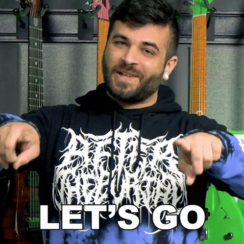 a man wearing a blue and black tie dye shirt says let 's go