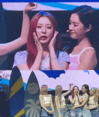 a group of girls are standing next to each other and one of them is wearing a shirt that says happy