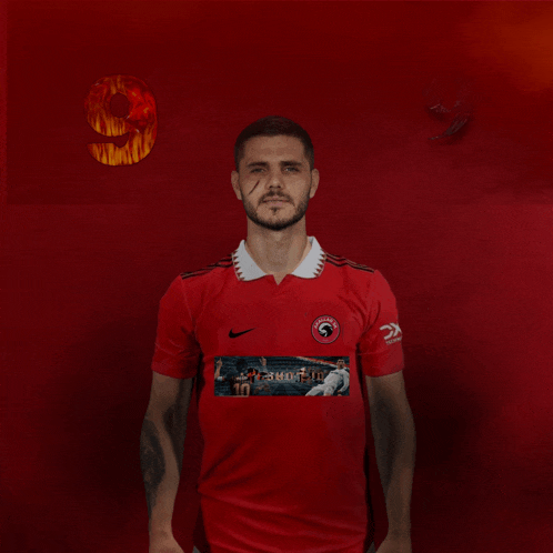 a man in a red shirt with the number 9 on the back
