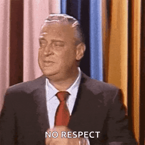 a man in a suit and tie is saying no respect .