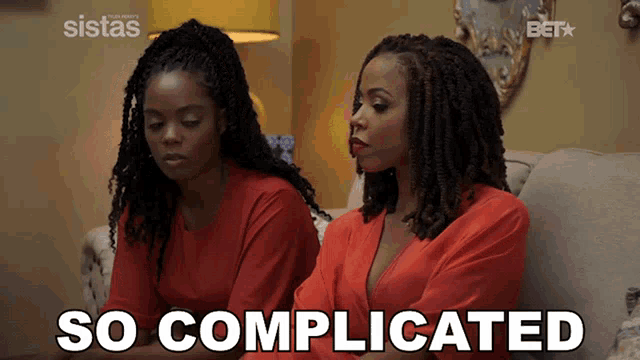 two women sitting on a couch with the words so complicated written on the screen