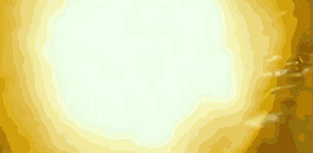 a close up of a person 's face with a light coming out of his eyes .