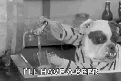 a black and white photo of a dog pouring beer into a glass .