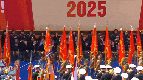 a group of soldiers marching in front of a poster that says 2025