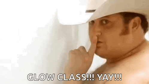 a shirtless man in a cowboy hat is holding his finger to his lips and saying `` glow class !!! yay !!! ''