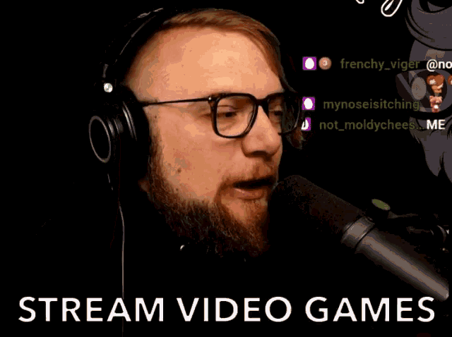 a man wearing glasses and headphones is talking into a microphone with the words stream video games behind him