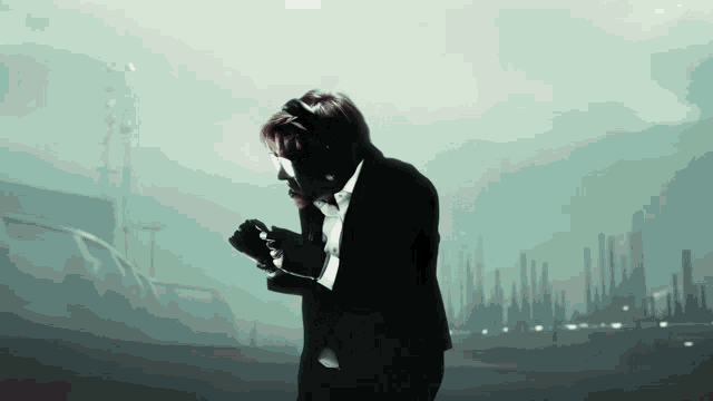a man in a suit is holding a camera in front of a city