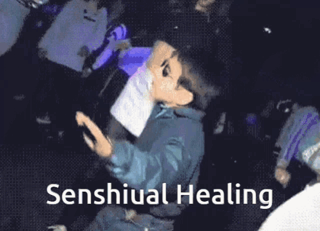a boy wearing sunglasses is dancing with the words senshual healing behind him
