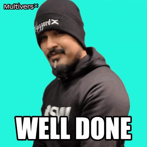 a man with a beard wearing a beanie and a hoodie says well done