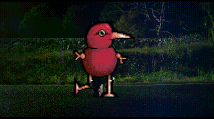 a car is driving down a road at night and a red bird is flying in the air