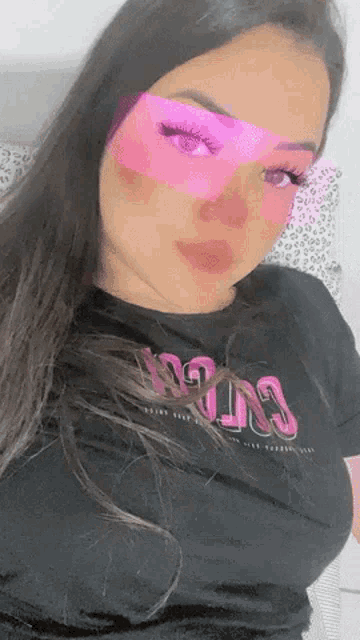a woman wearing a black shirt that says win