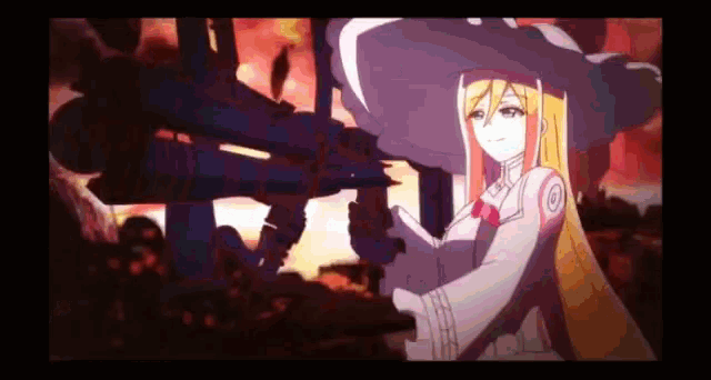 a girl in a witch hat is holding a gun in her hand .