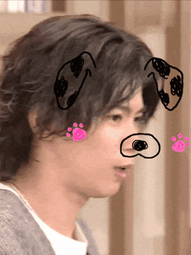 a close up of a person 's face with a dog drawing on it