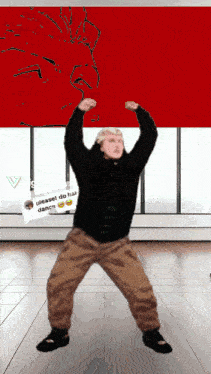a man dancing in front of a sign that says please do his dance