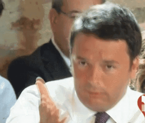 a man in a white shirt and tie is making a funny face