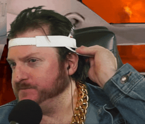 a man with a beard wearing a headband and headphones