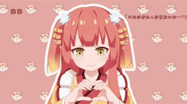 a girl with red hair making a heart with her hands