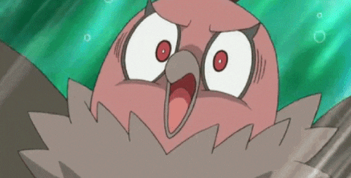 a close up of a cartoon bird with its mouth open and a surprised look on its face .