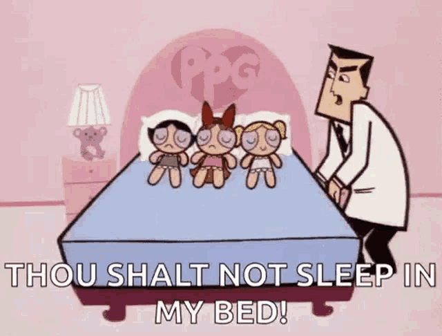 a man is standing next to a bed with three dolls on it and a cartoon character .