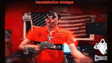 a man in a red shirt is holding a bunch of money in his hands .
