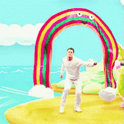 a man is standing in front of a colorful rainbow