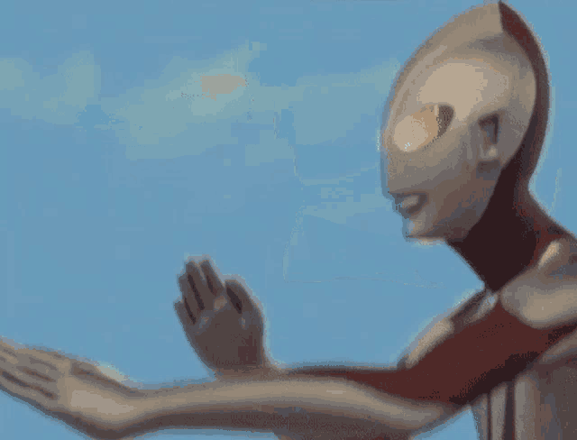 a man in a superhero costume is holding something in his hands