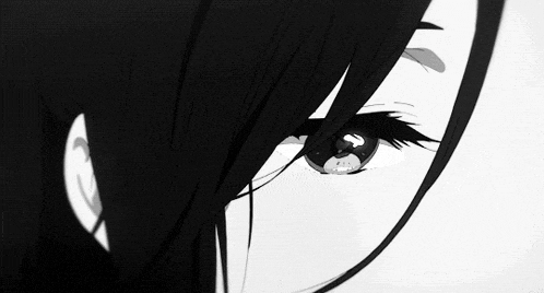 a black and white photo of a girl 's eyes .