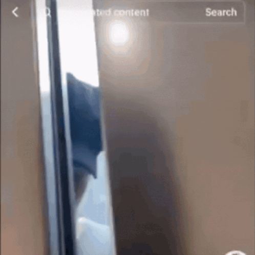 a phone screen shows a picture of a door and a search button
