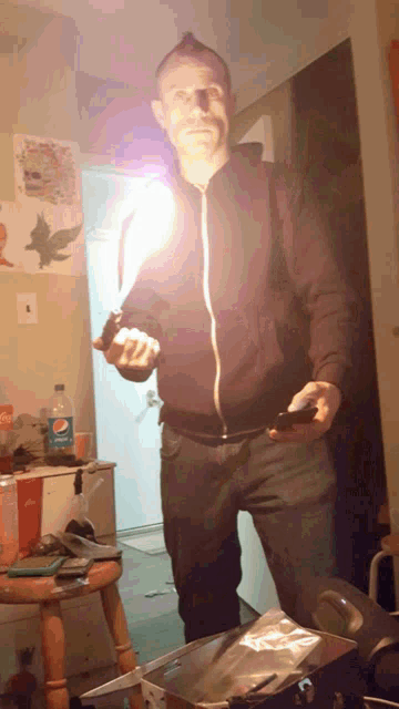 a man in a room with a pepsi bottle