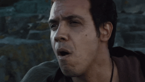 a close up of a man making a funny face
