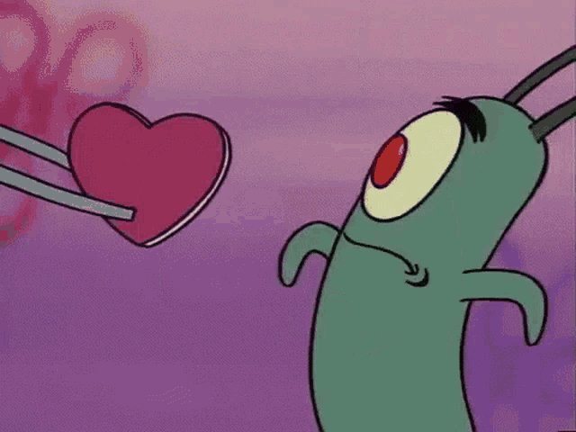 plankton is holding a pink heart in his hands .