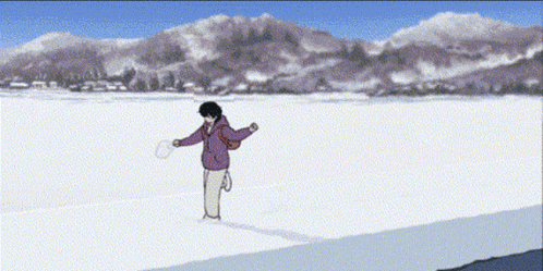 a person throwing a frisbee in the snow