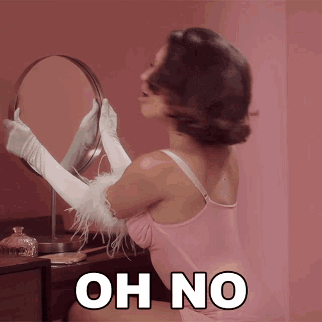 a woman is looking at herself in a mirror and the words oh no are below her