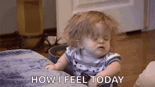 a baby girl is sitting on a couch and making a funny face while saying `` how i feel today '' .