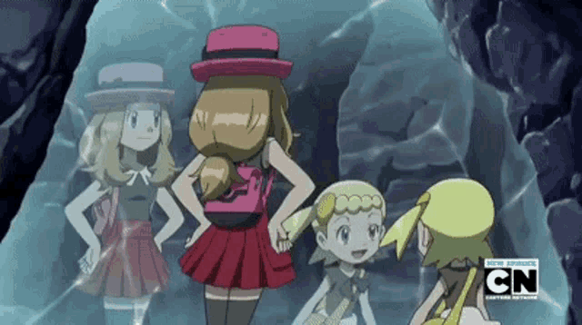 a group of girls are standing in a cave with cn written on the bottom right