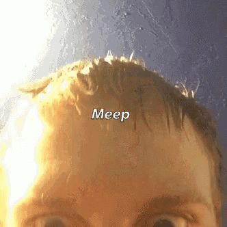 a close up of a person 's head with the word meep written on it