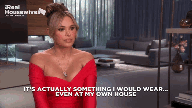 a woman in a red dress says it 's actually something i would wear ... even at my own house