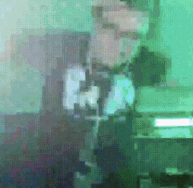 a green pixelated image of a person with the letter r on their shirt