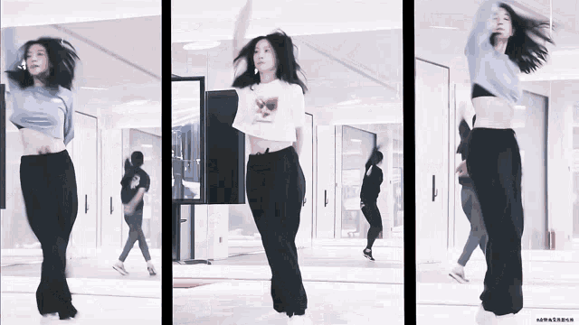 a woman in a crop top is dancing in front of a mirror in a room