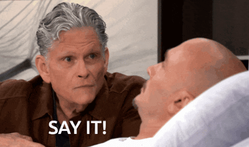 a man talking to another man in a hospital bed with the words say it on the bottom right