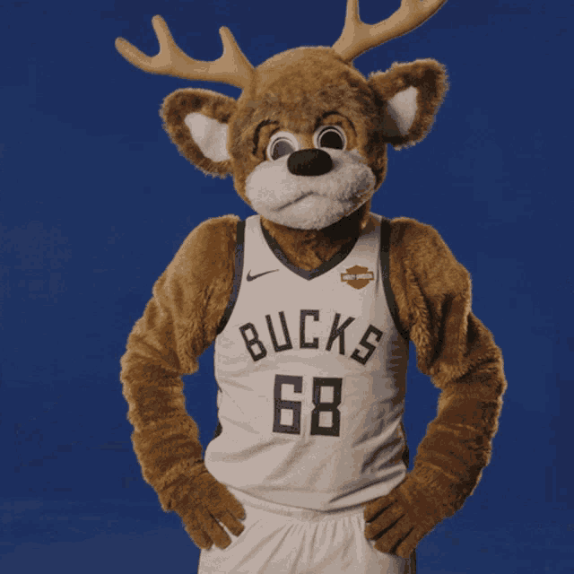a mascot for the bucks wears a white jersey with the number 68 on it