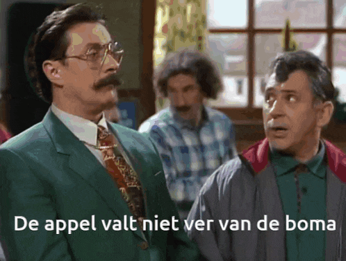 two men standing next to each other with the words de appel valt niet ver van de boma written below them