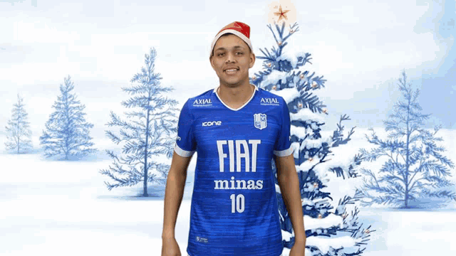 a man wearing a santa hat and a fiat minas shirt