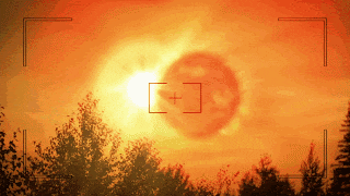 a picture of a sunset with a plus sign in the corner